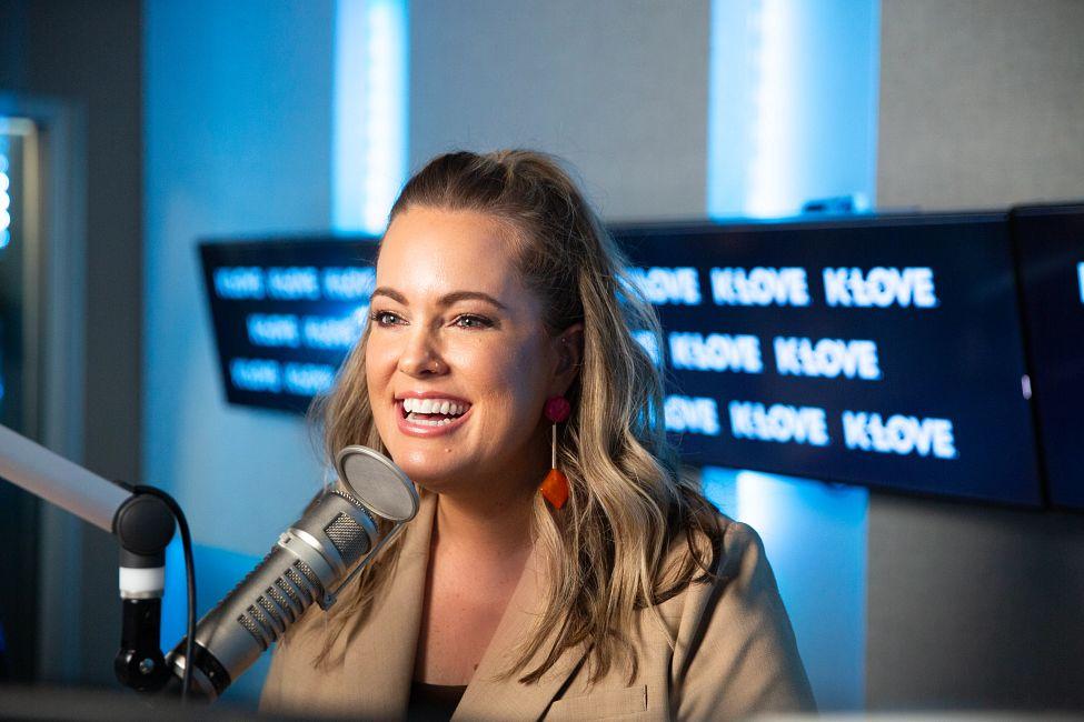 Lauree laughing and smiling in the k love studio